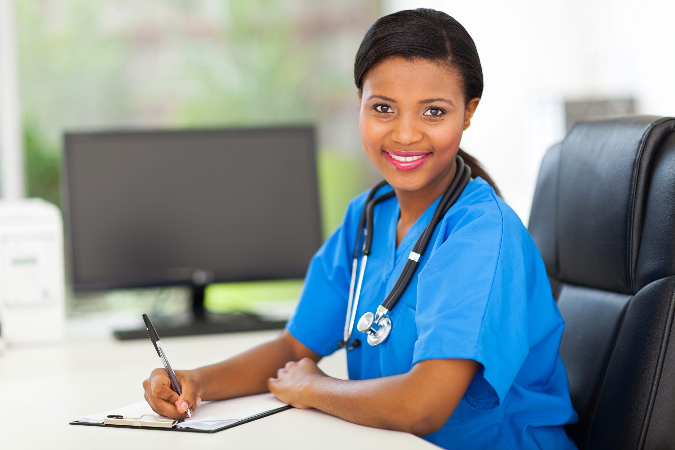 portrait of pretty female african doctor in modern office